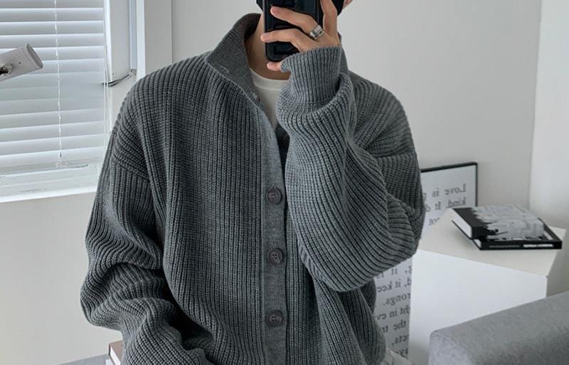 Cardigan sweater with stand collar and front buttons, worn by model