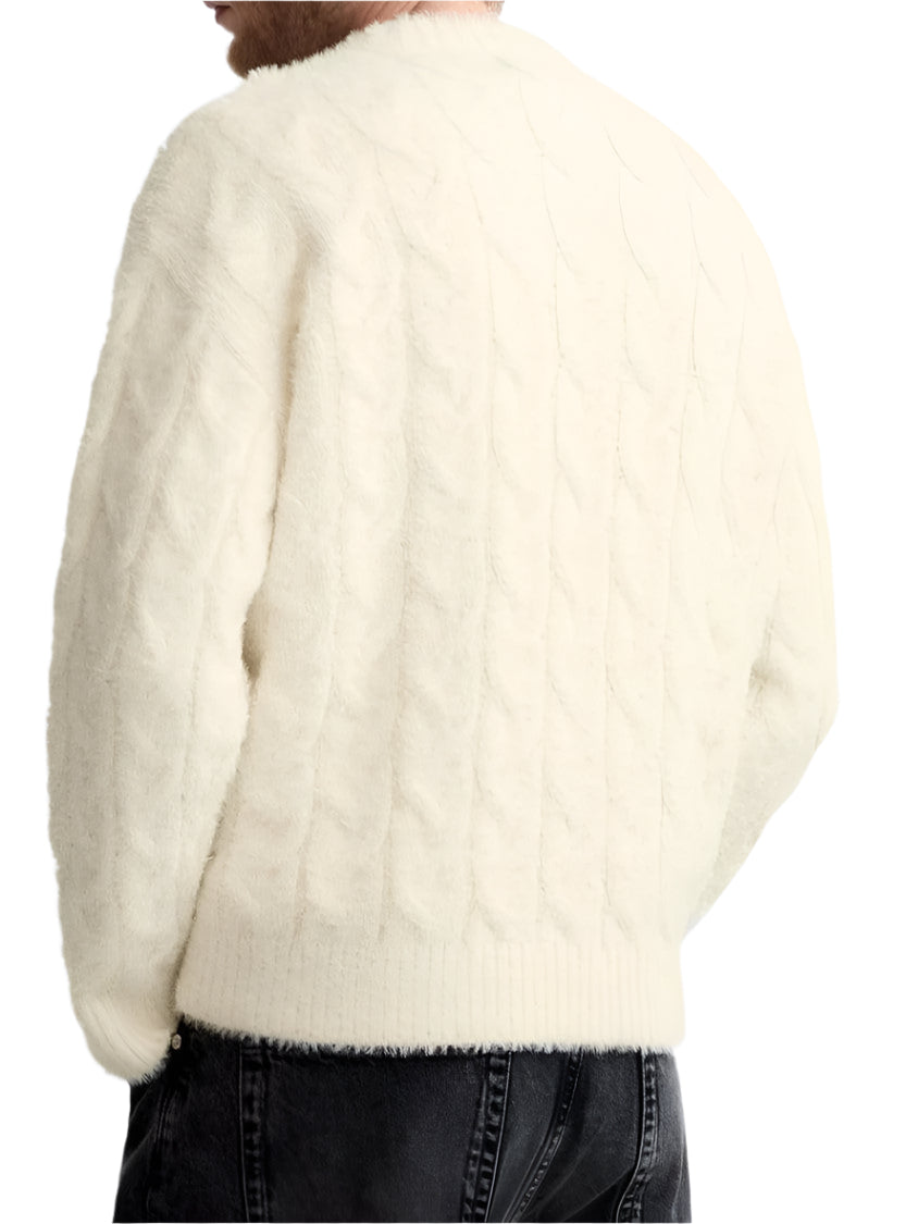 Pullover sweater with textured knit and long sleeves, shown on model
