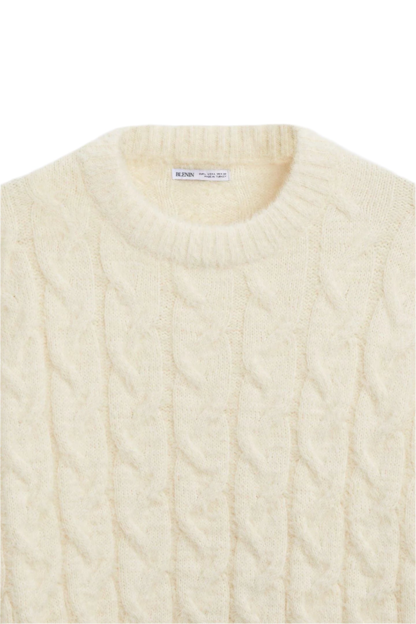 Flat-lay of men’s pullover sweater with cable detailing and ribbed edges
