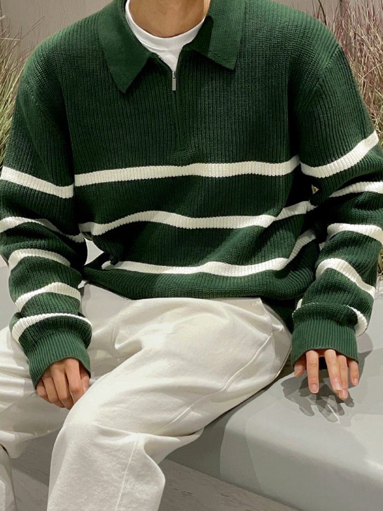Men’s half zip sweater with ribbed hem, high collar, and long sleeves, worn by model