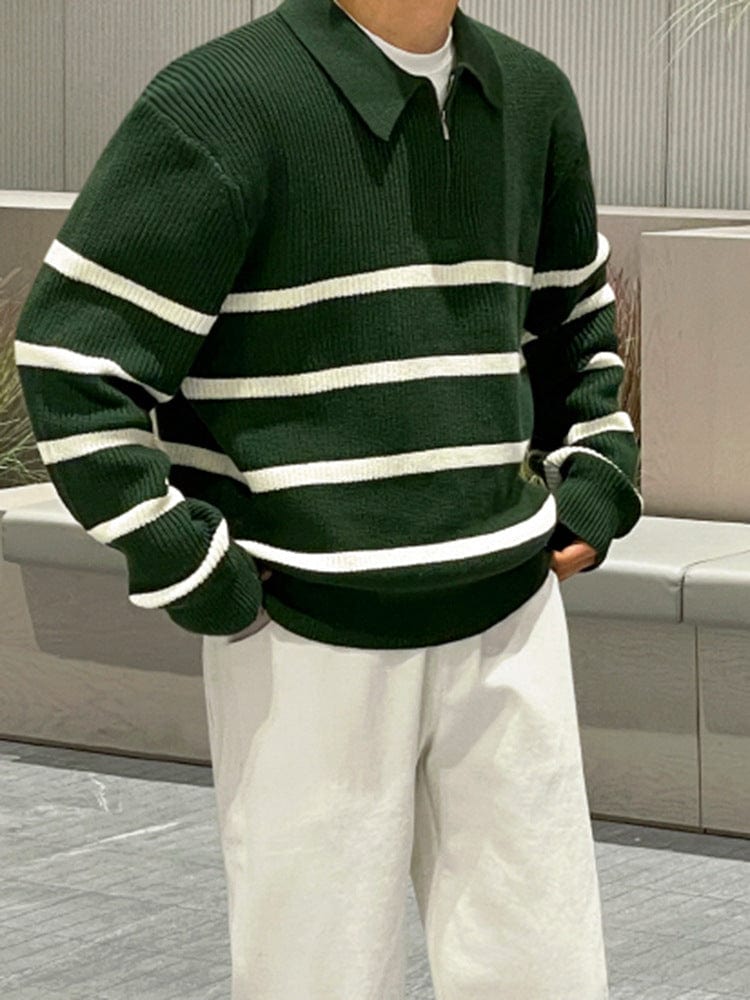 Men’s half zip sweater with ribbed hem, high collar, and long sleeves, worn by model