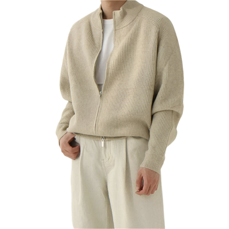 Men’s half zip sweater with stand collar, ribbed edges, and long sleeves, worn by model