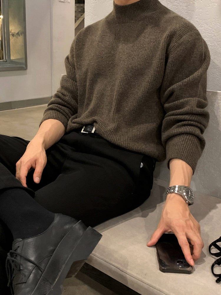 Half turtleneck sweater with knit surface and long sleeves, worn by model