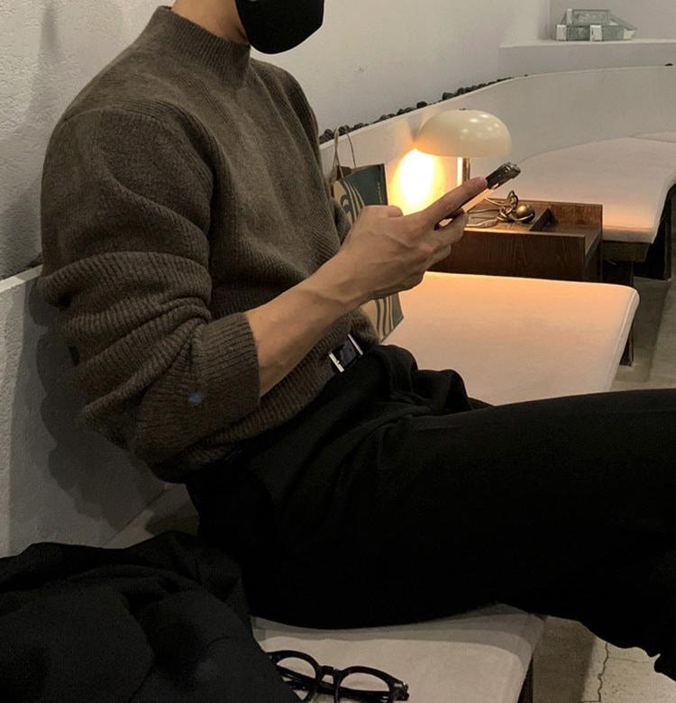 Half turtleneck sweater with knit surface and long sleeves, worn by model