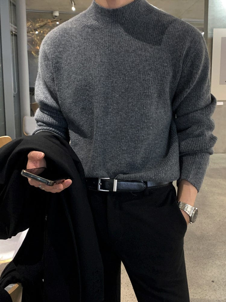Half turtleneck sweater with knit surface and long sleeves, worn by model