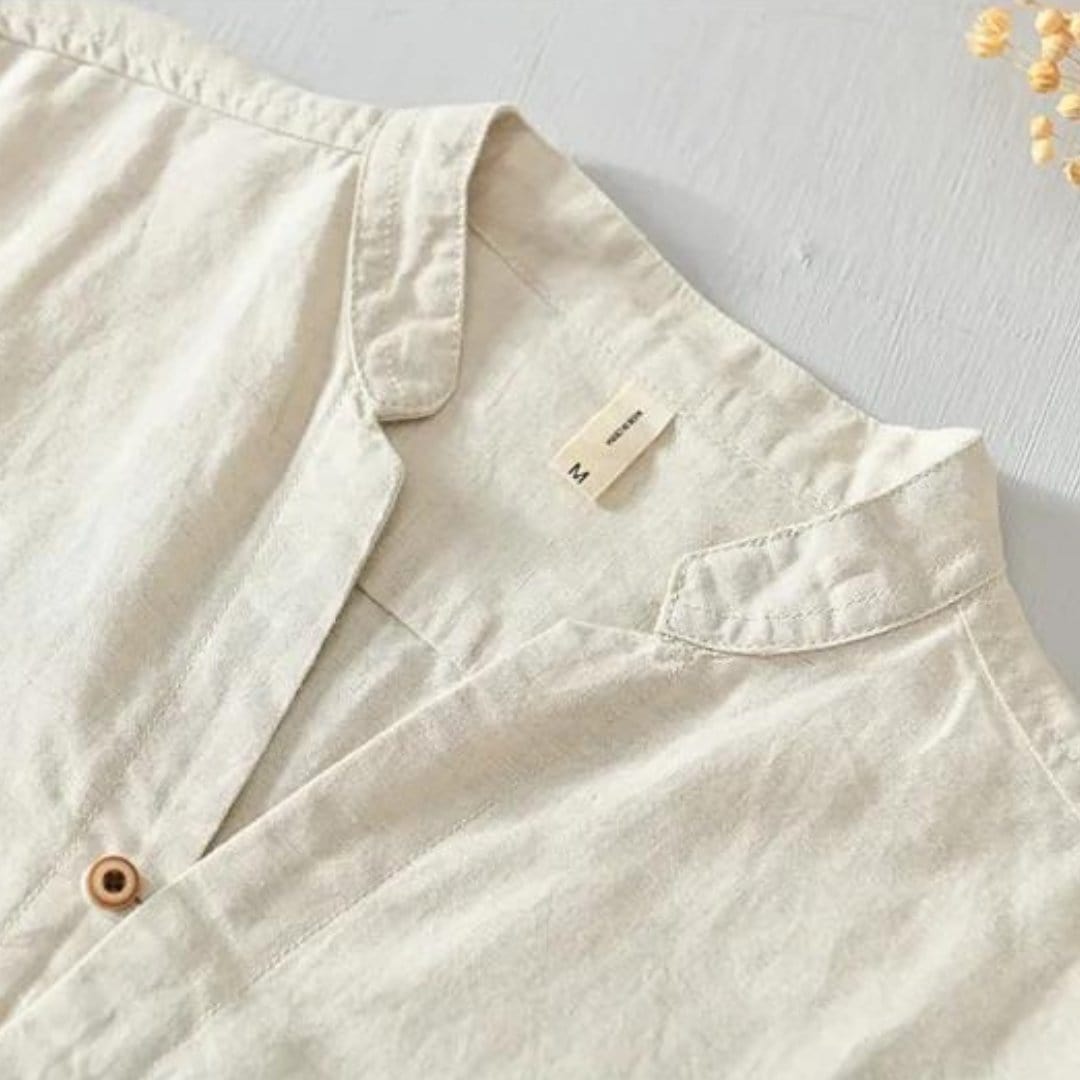 Long sleeve shirt with mandarin collar and button front, laid flat