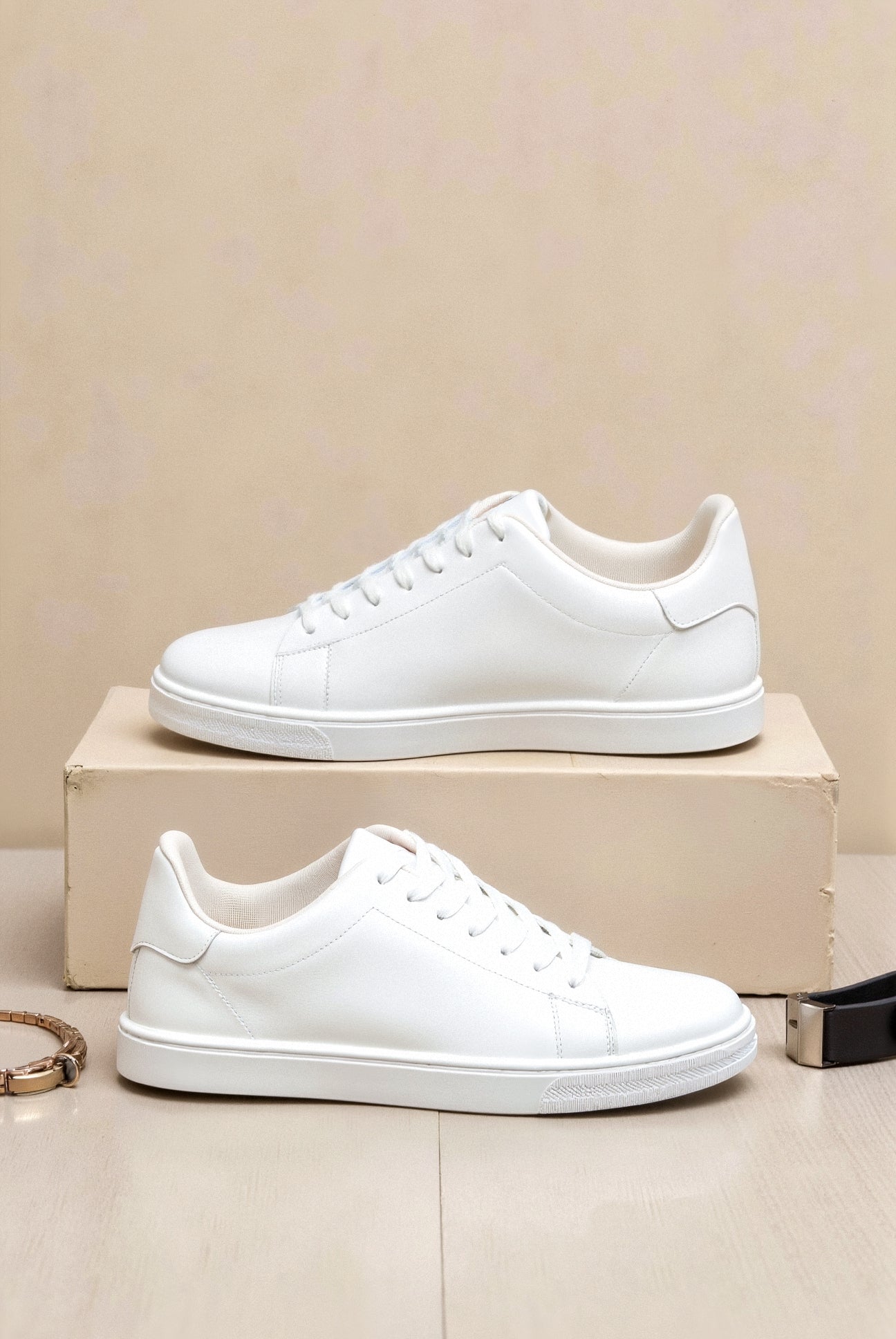 Side view of lace-up sneakers with curved sole and structured upper
