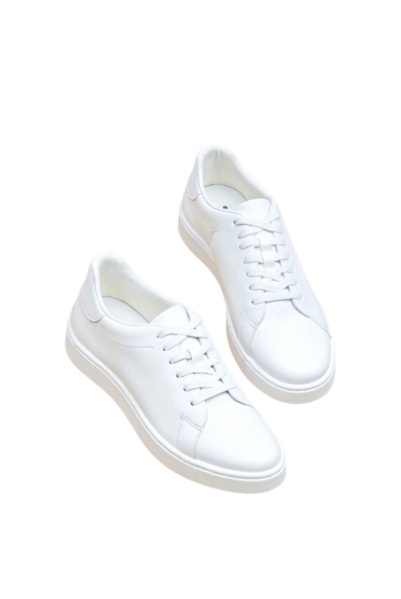 Top-down view of sneakers with lace detail and outsole texture