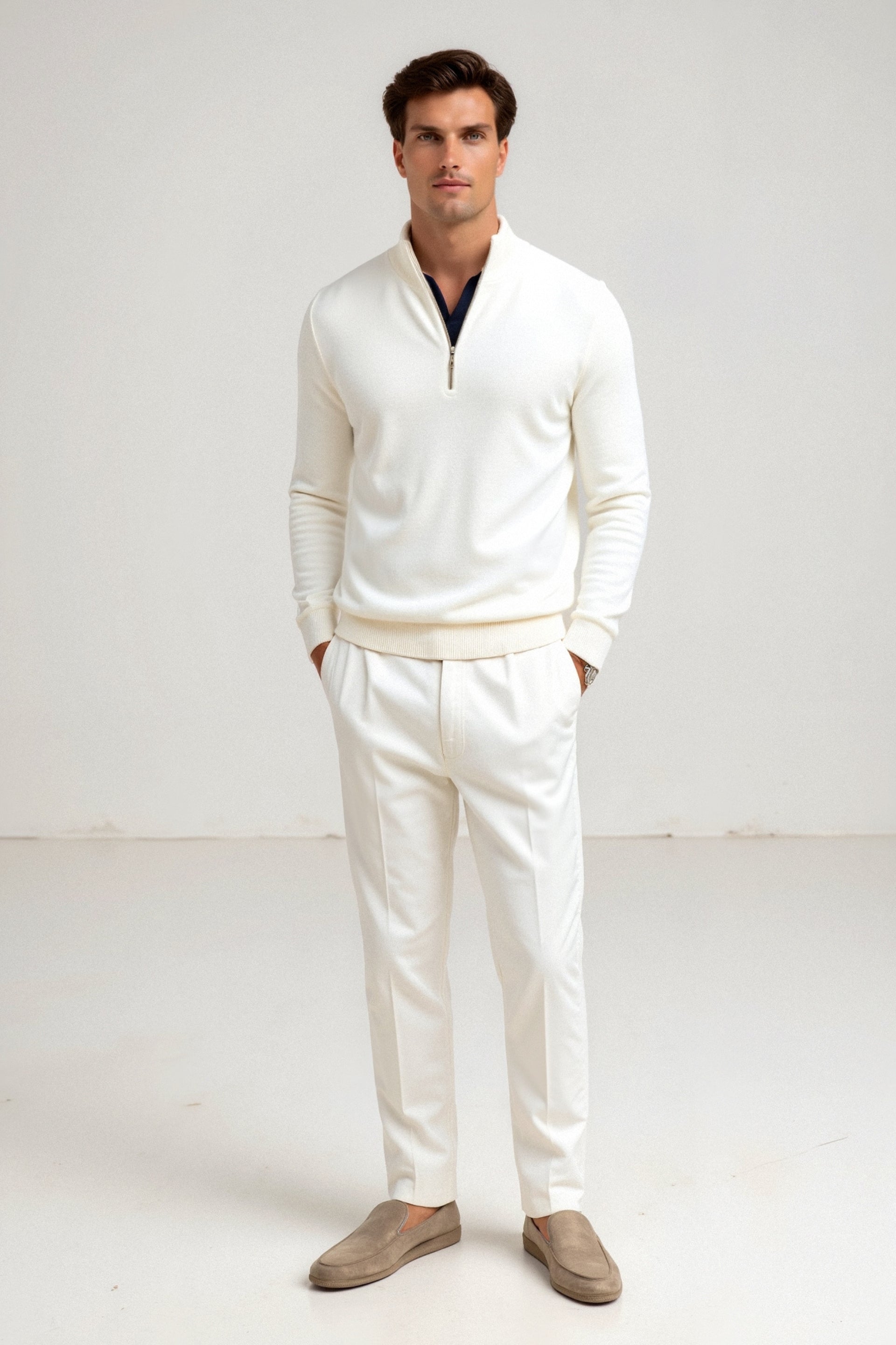 Model wearing quarter-zip pullover with high collar and ribbed sleeves