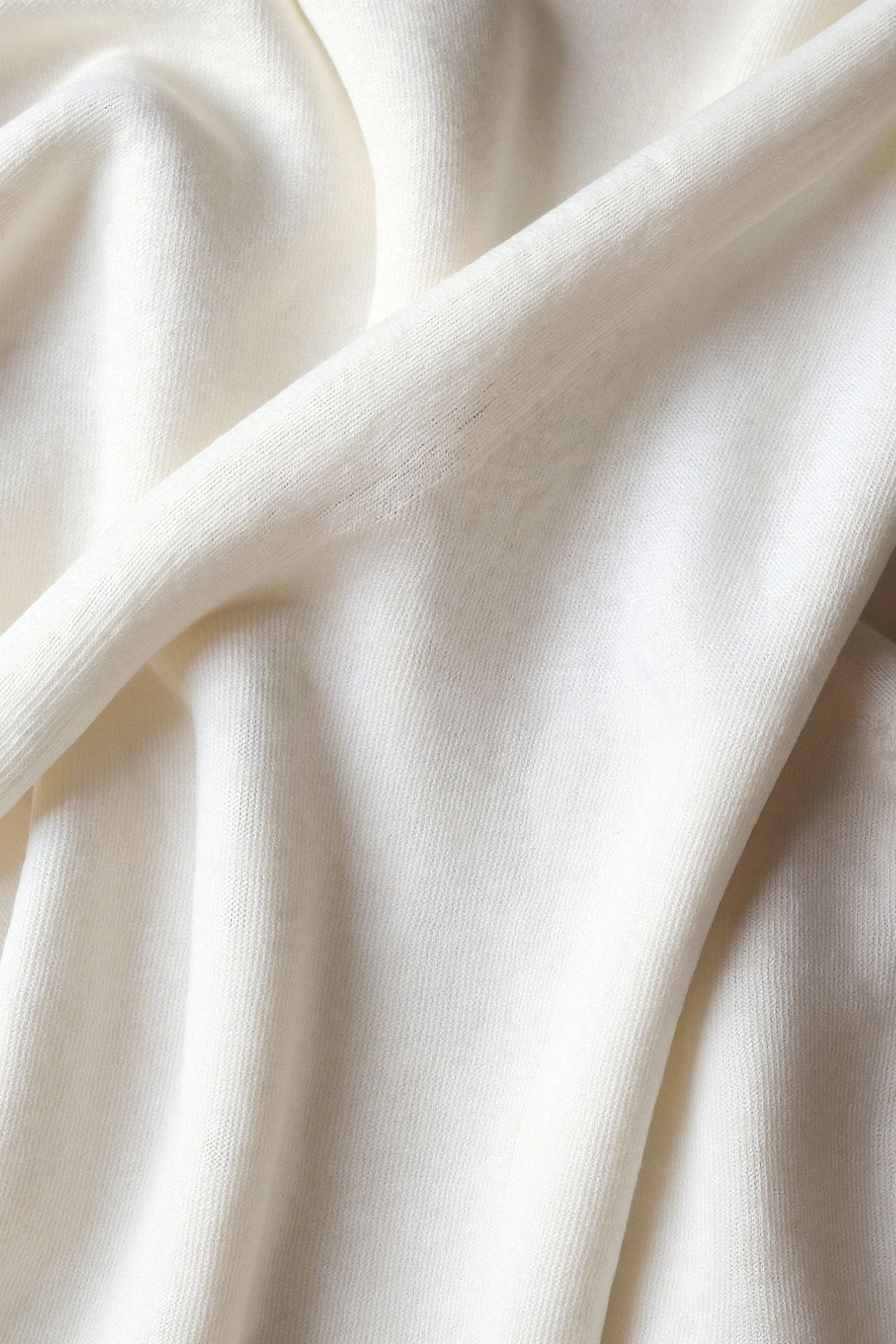 Pullover with ribbed hem and high collar, laid flat