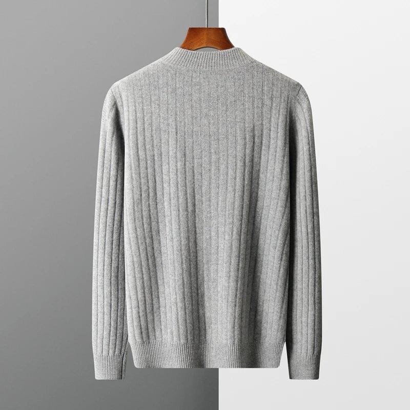 Sweater with knit texture and zip collar, hanging on display