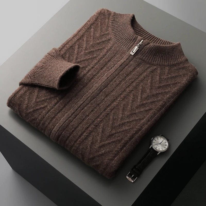 Quarter zip sweater with knit texture and ribbed cuffs, laid flat