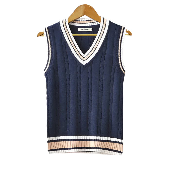 Sleeveless sweater with ribbed hem and clean neckline, displayed on hanger