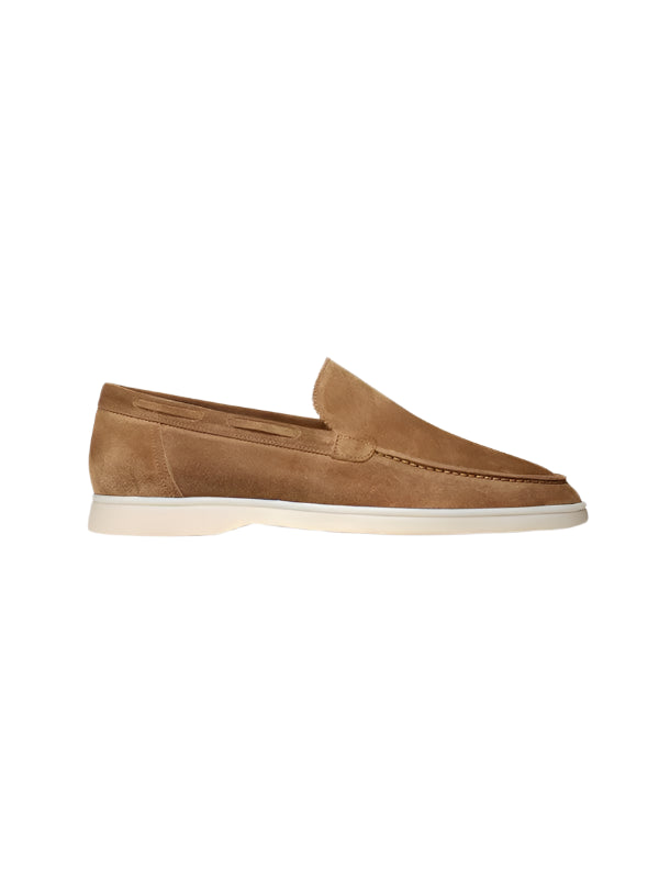 Slip-on loafers with plain upper and low-cut opening, laid flat