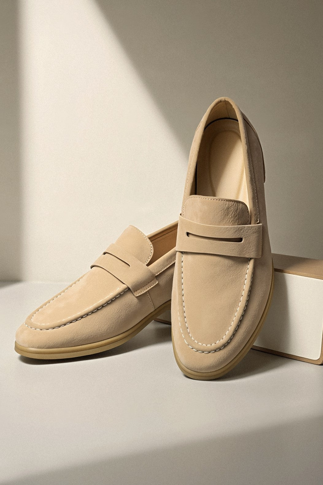 Loafers with round toe and slot detail, photographed from top view