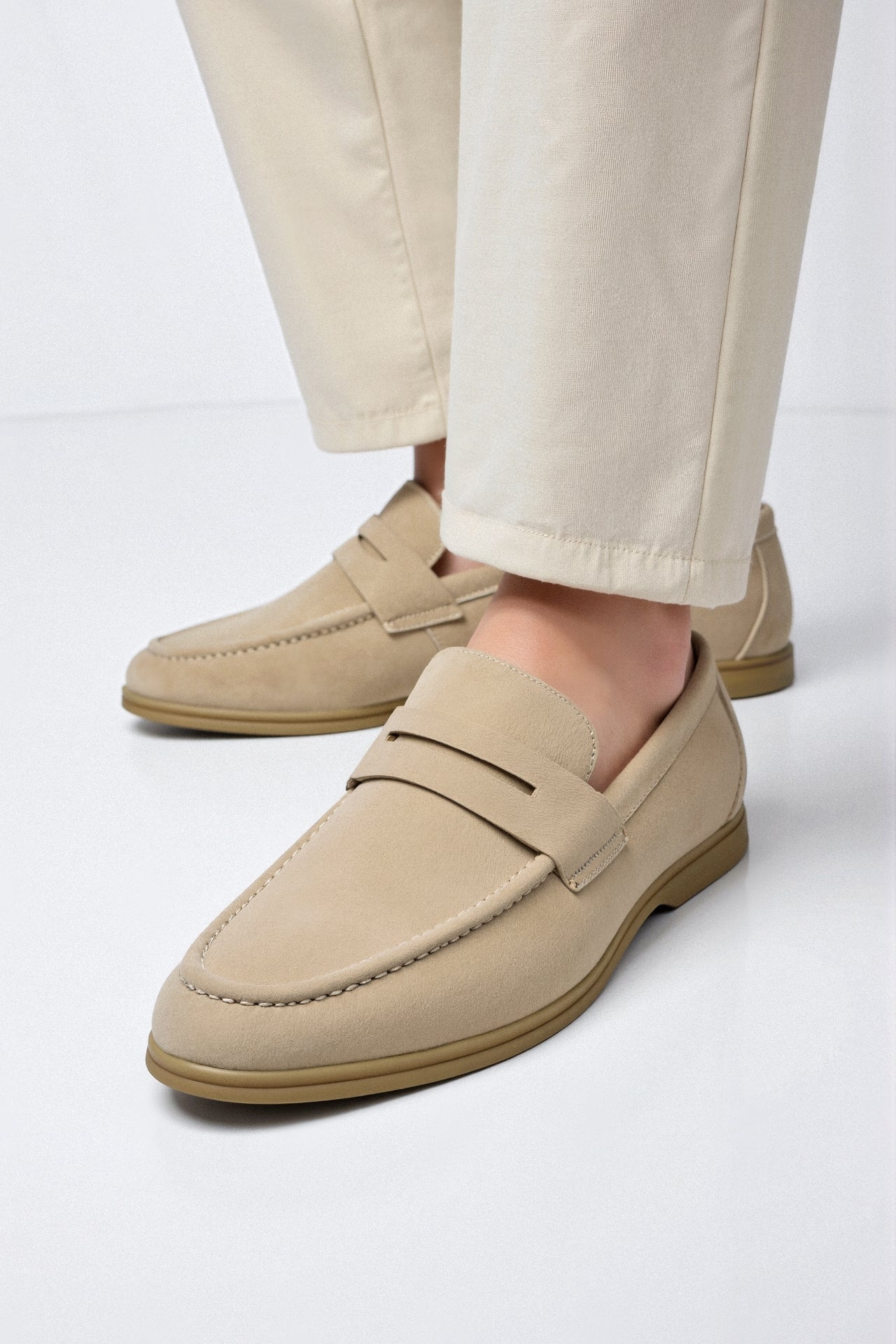 Model in slip-on loafers with flat outsole and minimal design