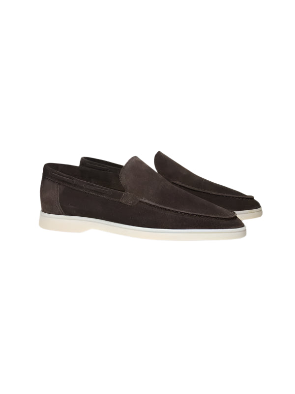Men’s slip-on shoes with plain upper and minimal design, laid flat