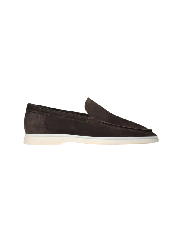 Slip-on loafers with rounded toe and visible stitching, laid flat