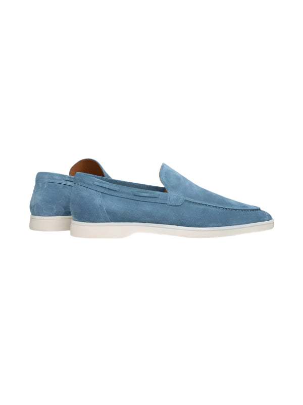Slip-on loafers with rounded toe and flat sole, laid flat