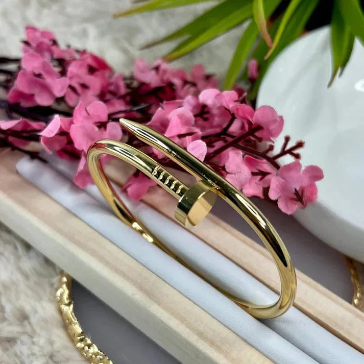 Wraparound spike bracelet with open cuff shape, laid flat