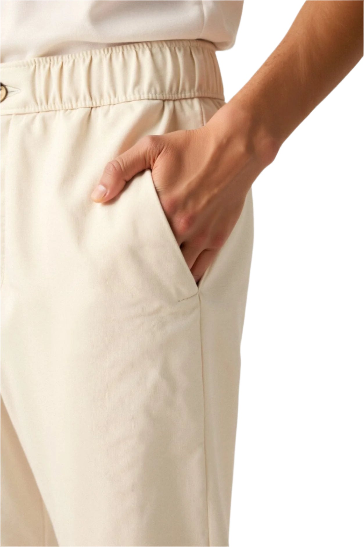 Men’s pants with flat front, belt loops, and back pockets, worn by model