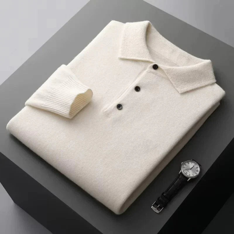 Long sleeve sweater with round neckline, laid flat on surface