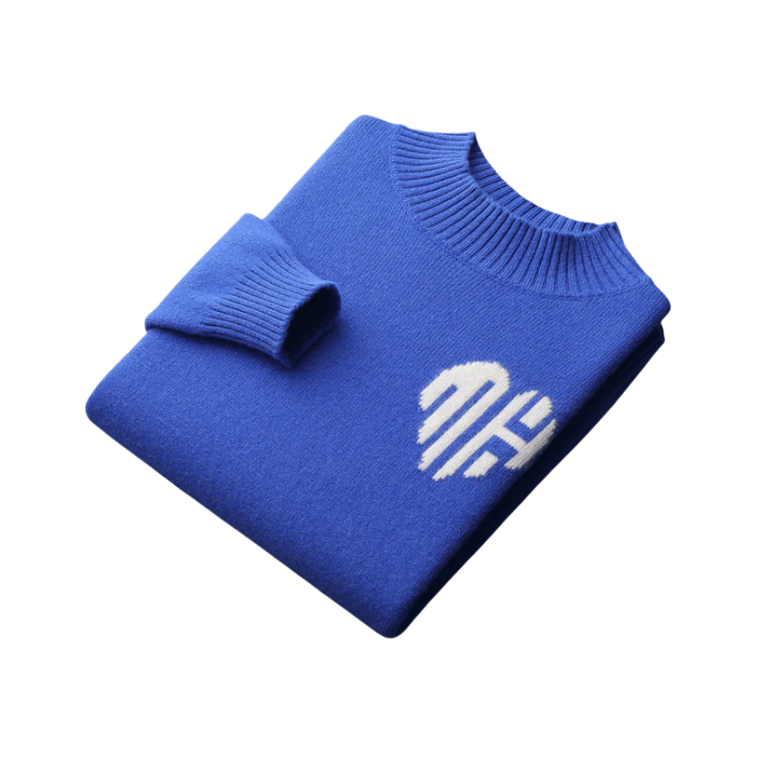 Pullover sweater with visible seams, laid flat on surface