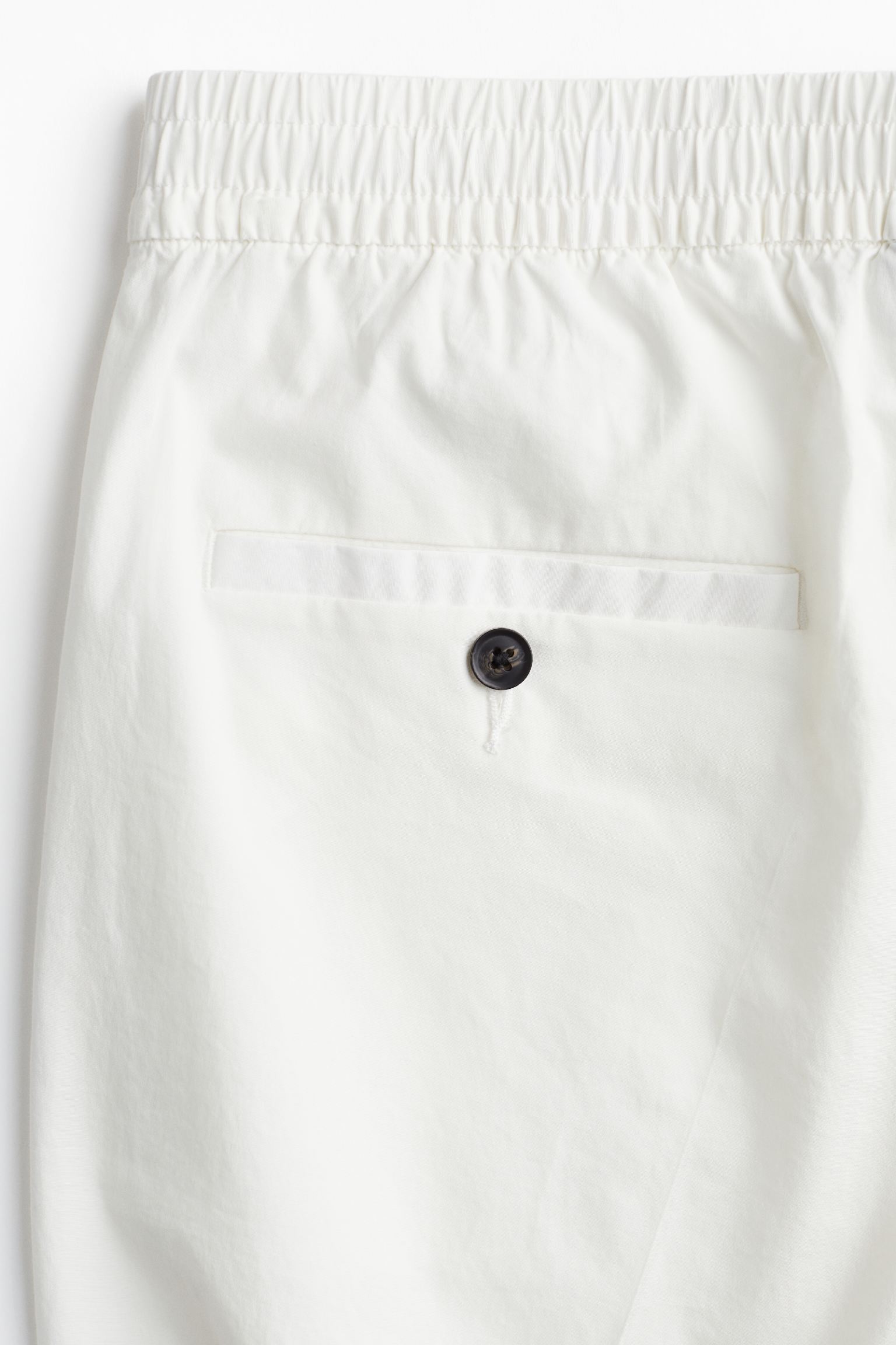 Men’s pants with stitched front panels and standard length, flat view