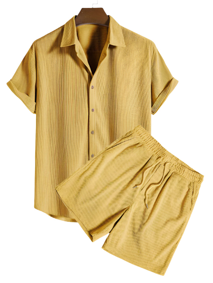 Two-piece outfit with short sleeve shirt and shorts, laid flat