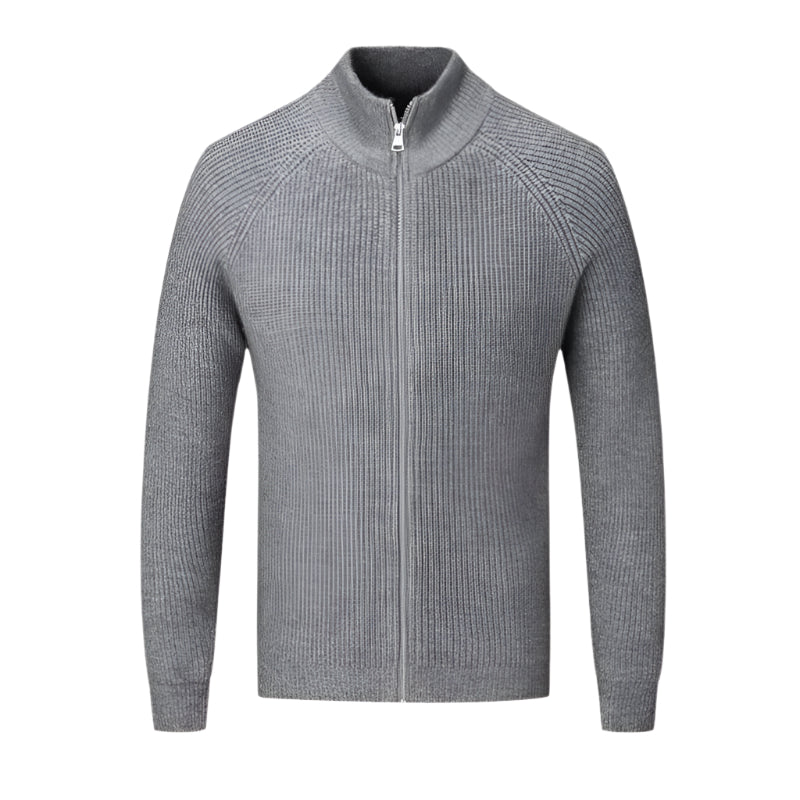 Sweater with ribbed edges and front zipper, displayed flat