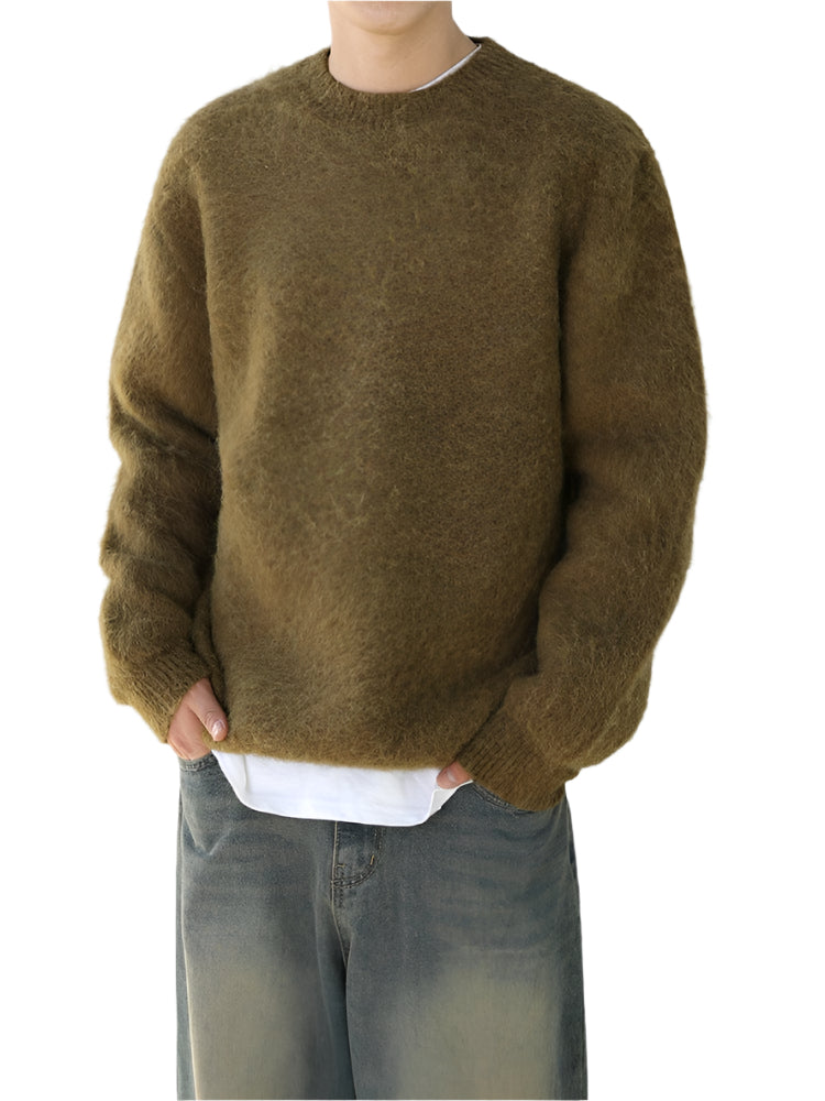 Wool blend sweater with ribbed cuffs and long sleeves, worn by model
