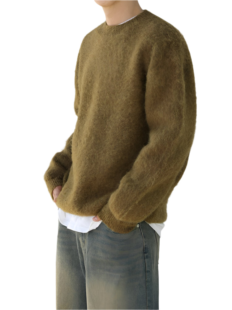 Wool blend sweater with ribbed cuffs and long sleeves, worn by model