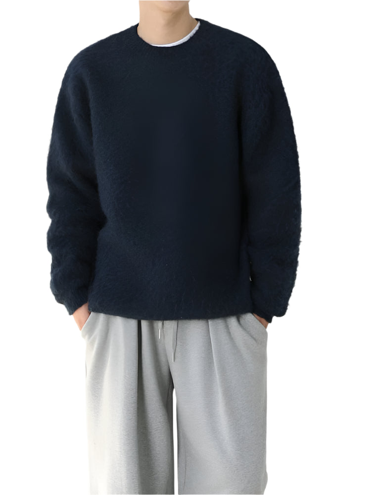 Wool blend sweater with ribbed cuffs and long sleeves, worn by model